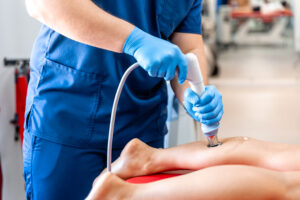 Patient receiving shockwave therapy in Ottawa