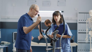 Physiotherapist helping a patient recover from a motor vehicle accident injury at Care2Cure clinic in Ottawa