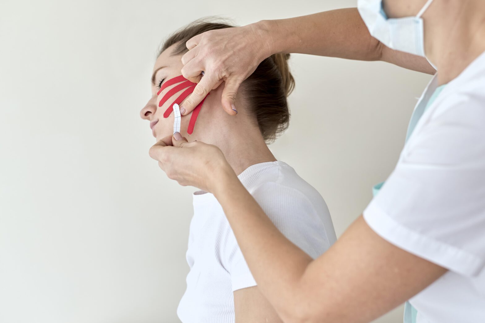 Patient receiving TMJ and jaw pain treatment at Care2Cure Physiotherapy in Nepean Ottawa