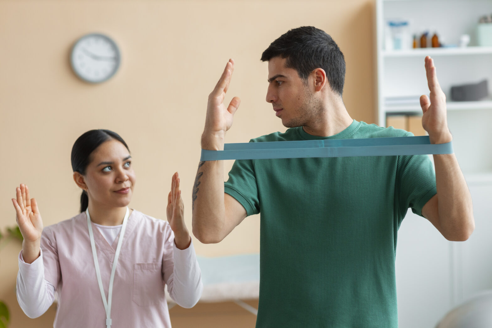 Patient discussing treatment plan with physiotherapist at Care2Cure Barrhaven clinic