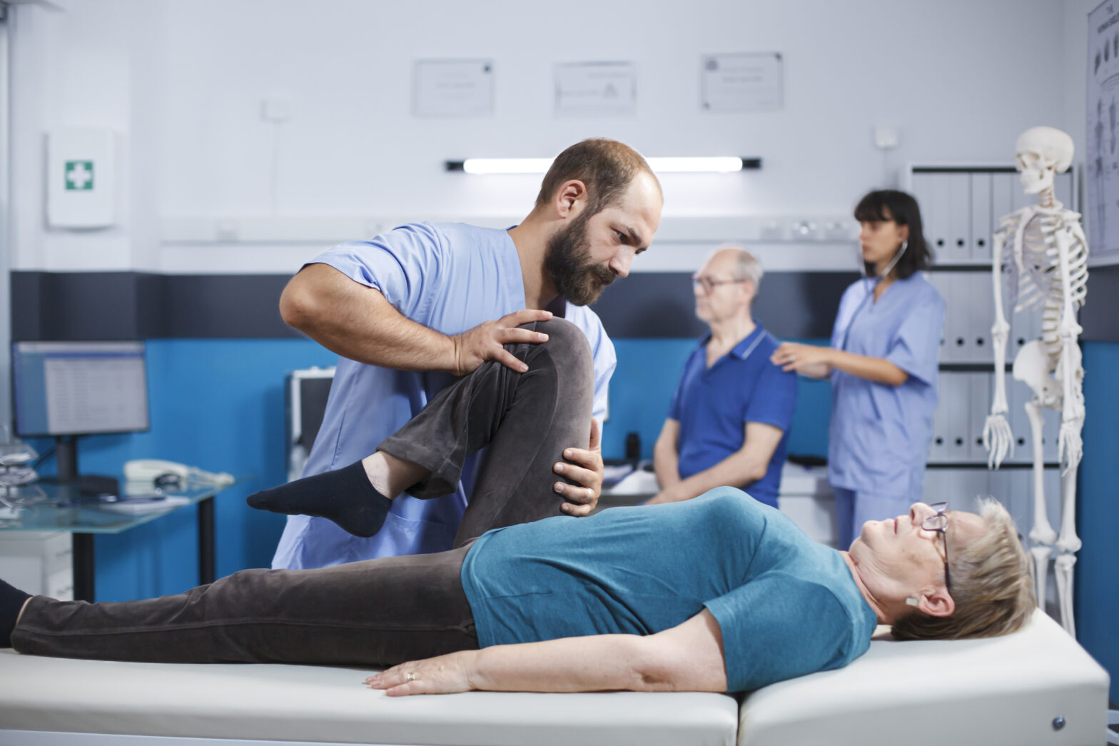 Physiotherapist assisting a patient with rehabilitation exercises at Care2Cure Physiotherapy & Rehab Center in Ottawa