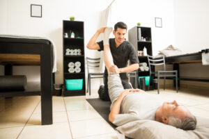 Physiotherapist guiding a patient through active recovery exercises in Ottawa