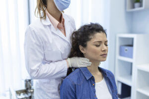 Physiotherapist assessing a patient with neck and arm pain due to cervical radiculopathy in Barrhaven, Ottawa